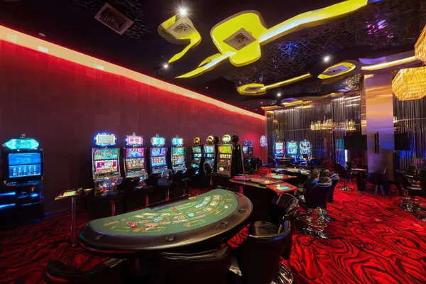 A glamorous woman holding casino chips in a neon-lit environment, representing the premium online casino atmosphere of OKTA.