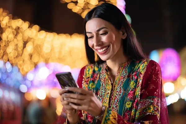 A glowing roulette wheel with cascading chips, symbolizing the engaging live and instant-win games available on OKTA.